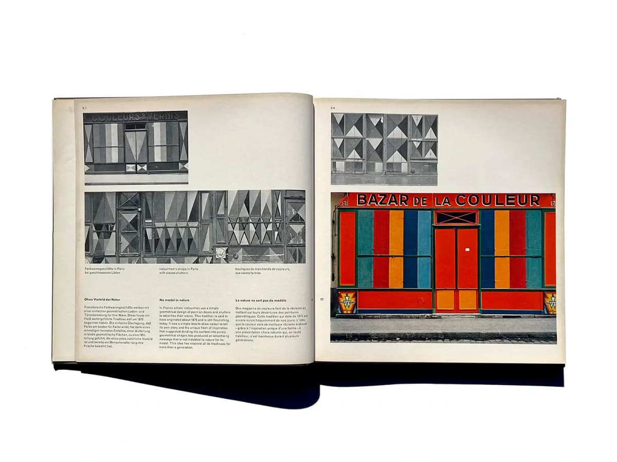 A spread from Die neue Graphik showing Parisian paint shops and three language columns