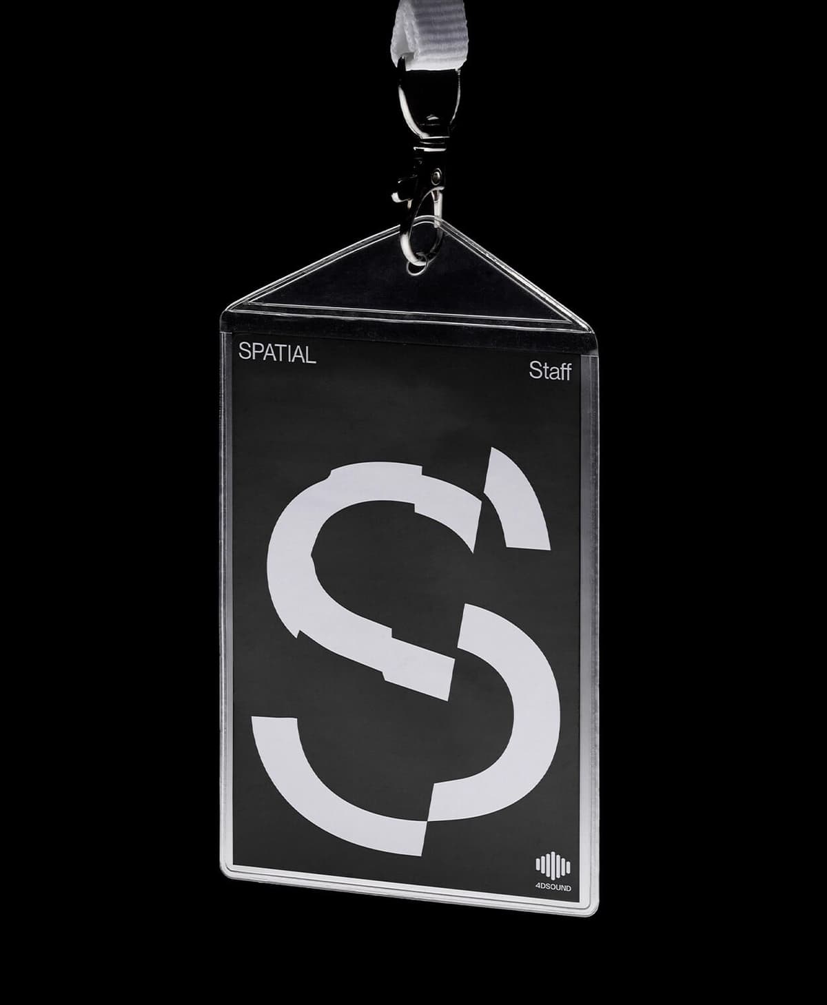 Black Spatial staff pass with a large fragmented white S and a white lanyard